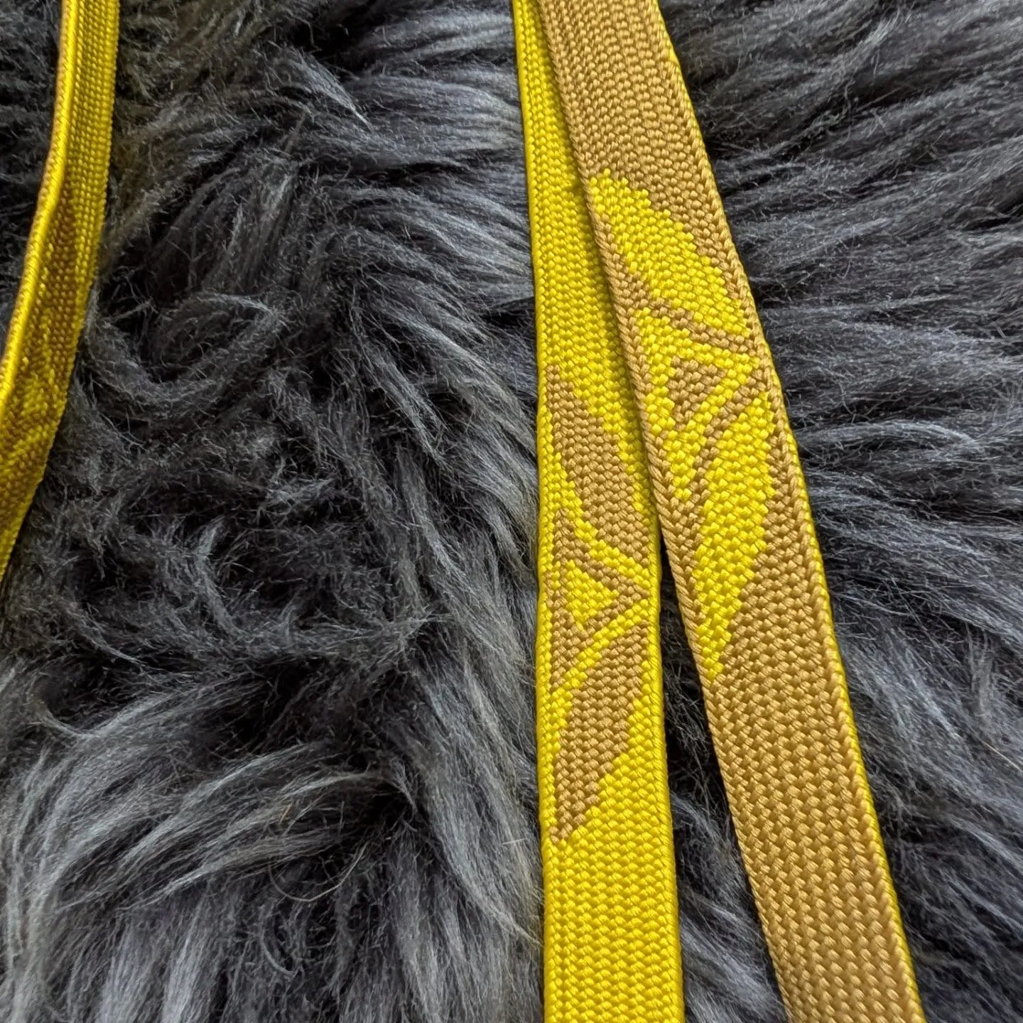 Close-up of the pattern on the finished braid in yellow and gold silk
